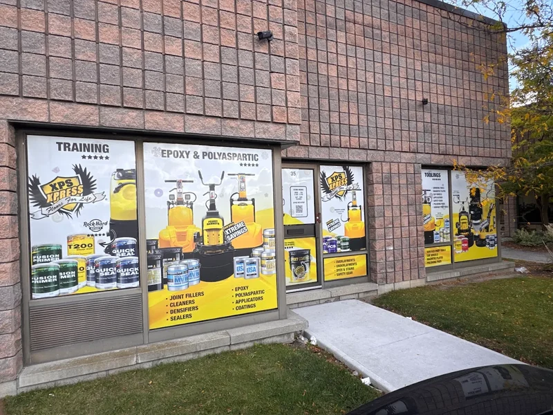 The XPS Xpress storefront at 90 Nolan Ct in Markham, with yellow training and product posters in the windows